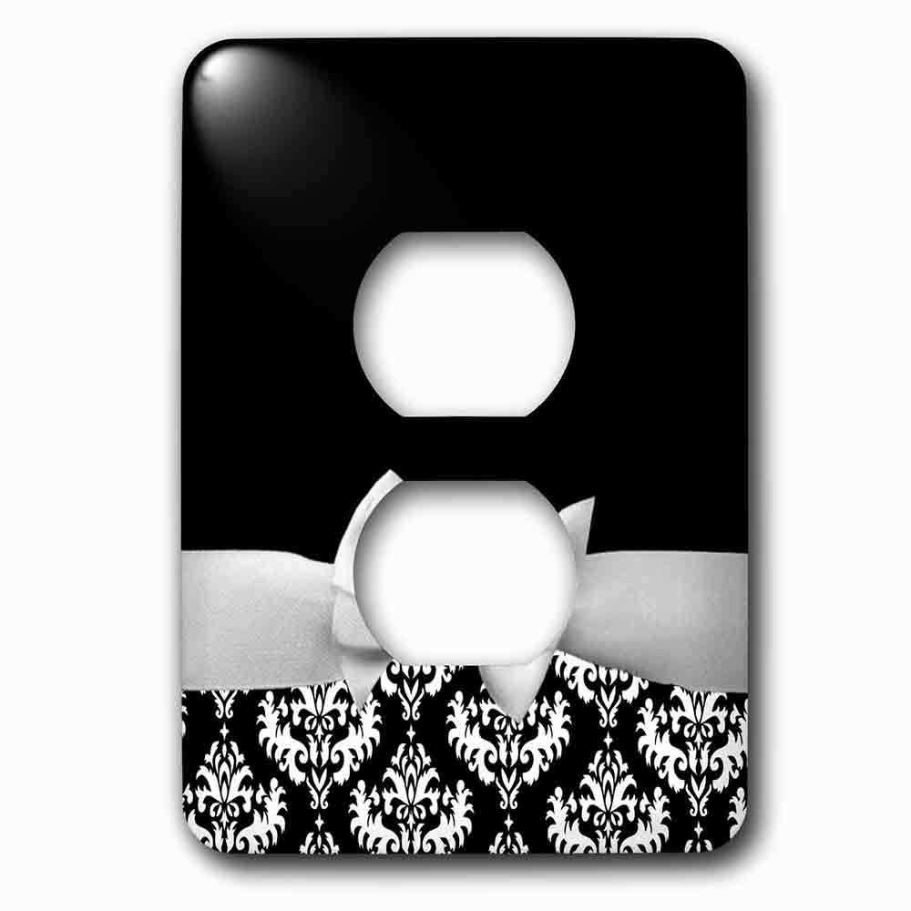 Single Duplex Outlet With Elegant And Classy White Ribbon Bow With White Damask Pattern And Classic Black Background