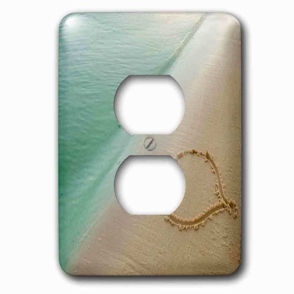 Single Duplex Outlet With Heart Shape Symbolizing Love, Heart Carved In Sand On The Beach